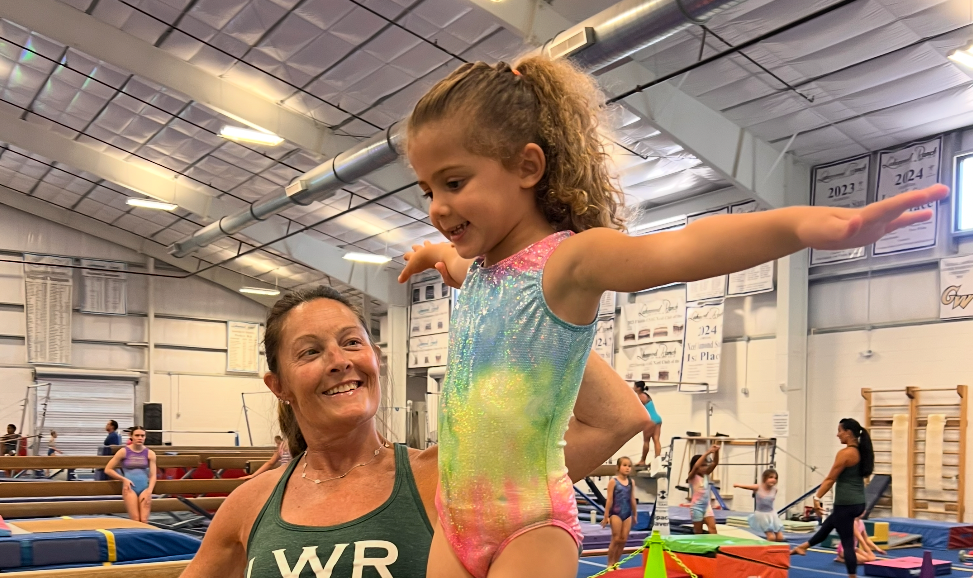 Excellent Explorers gymnastics class with coach and young gymnast